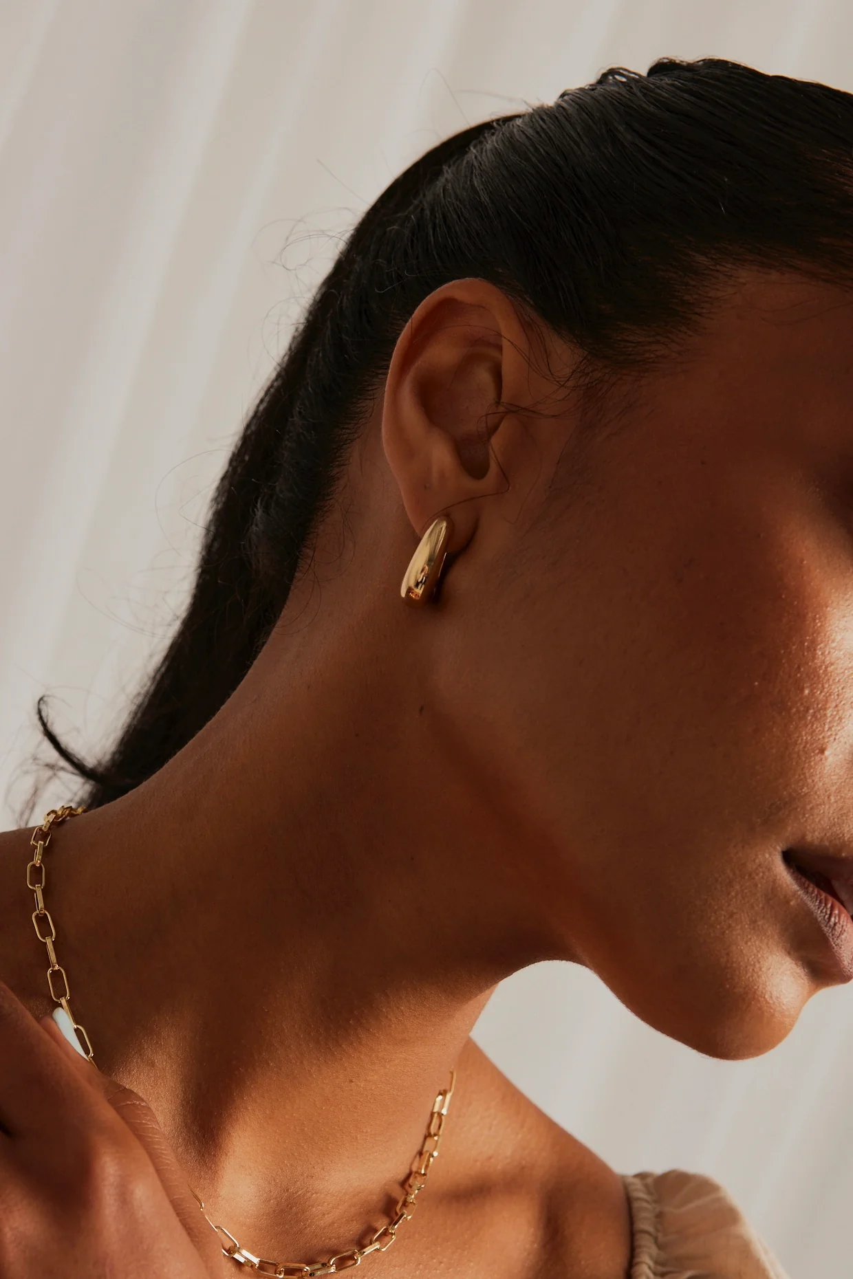 Chunky Drop Gold Hoop Earrings - Image 3