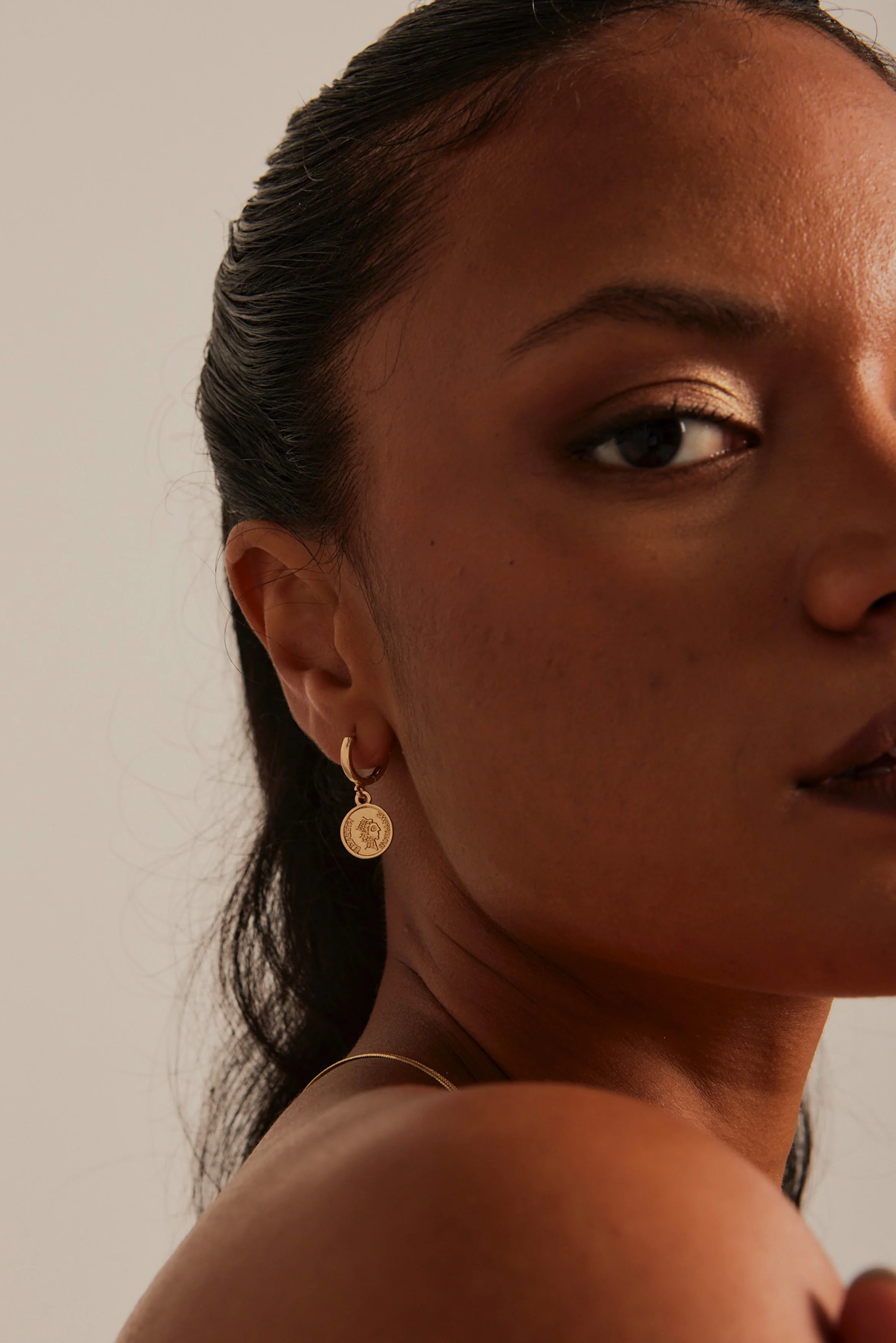 Coin EOL Huggie Gold Earrings - Image 2