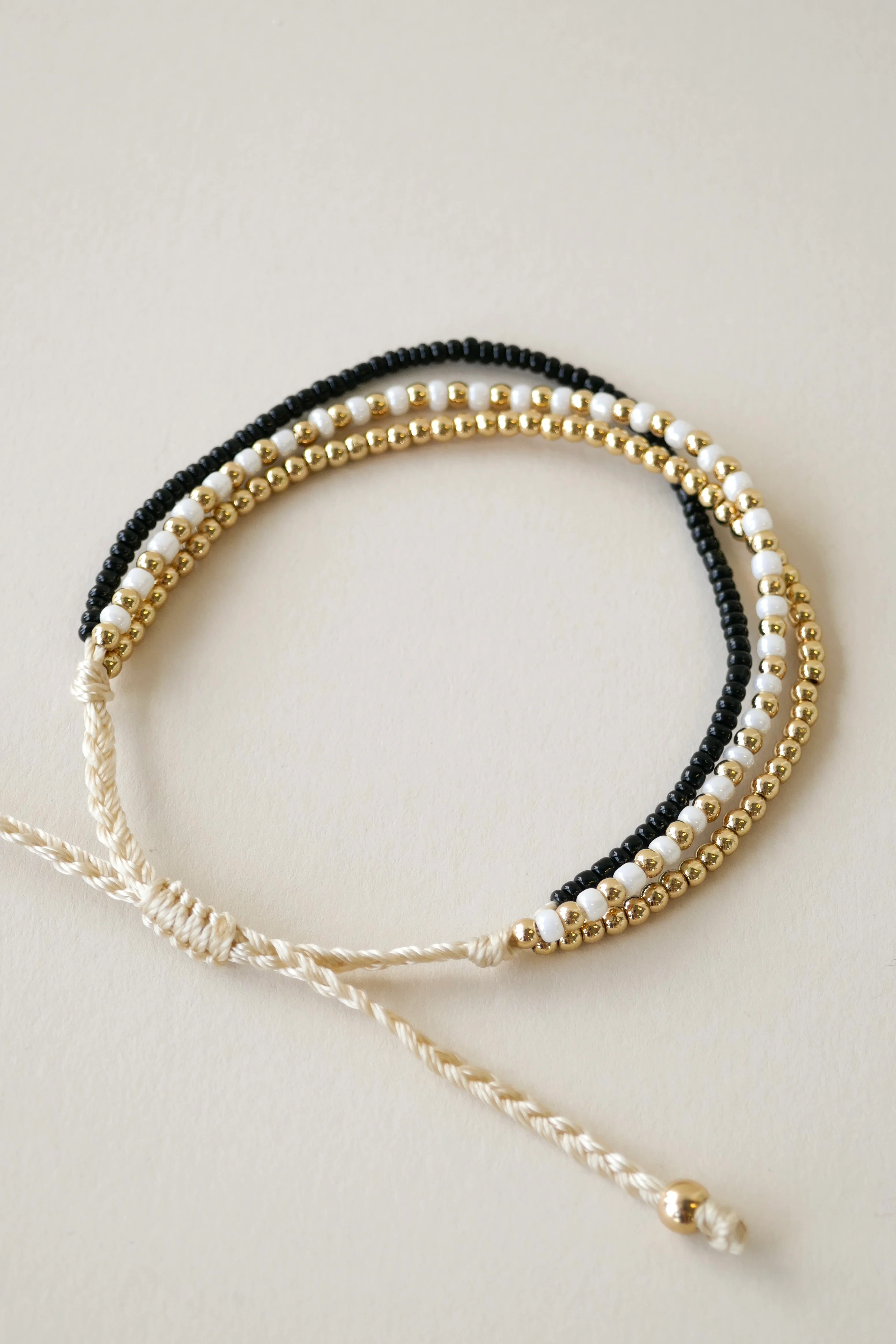 Triple Bead EOL Gold Black White Bracelet - Image 2