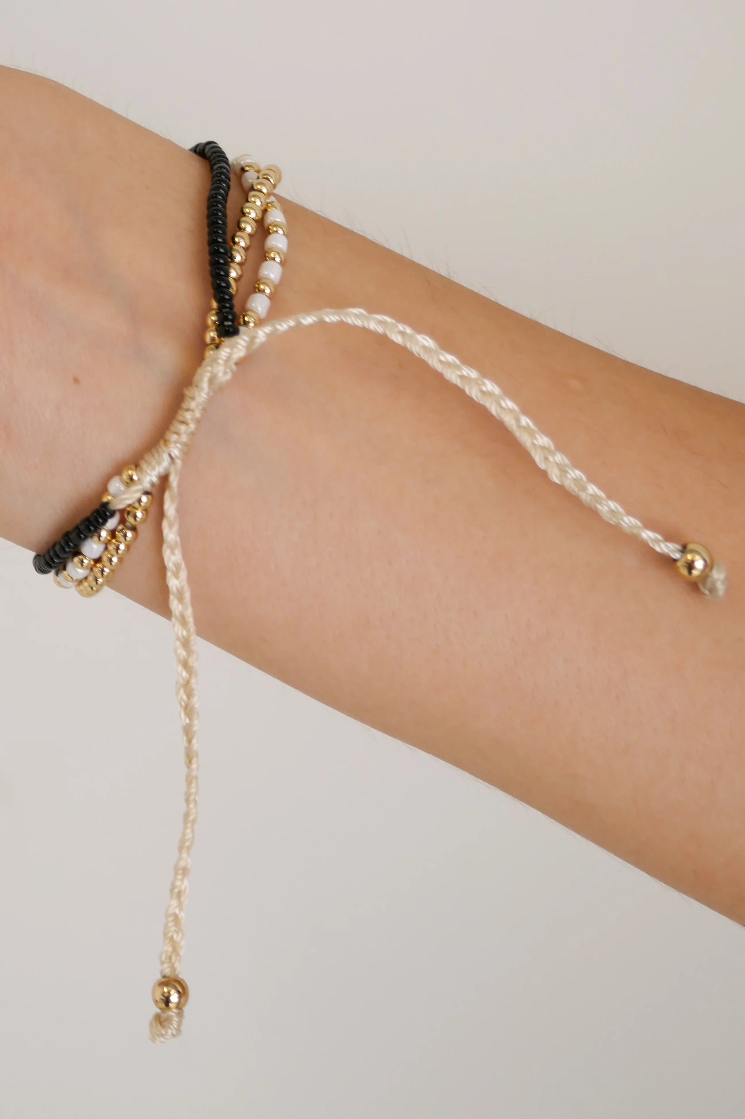 Triple Bead EOL Gold Black White Bracelet - Image 4